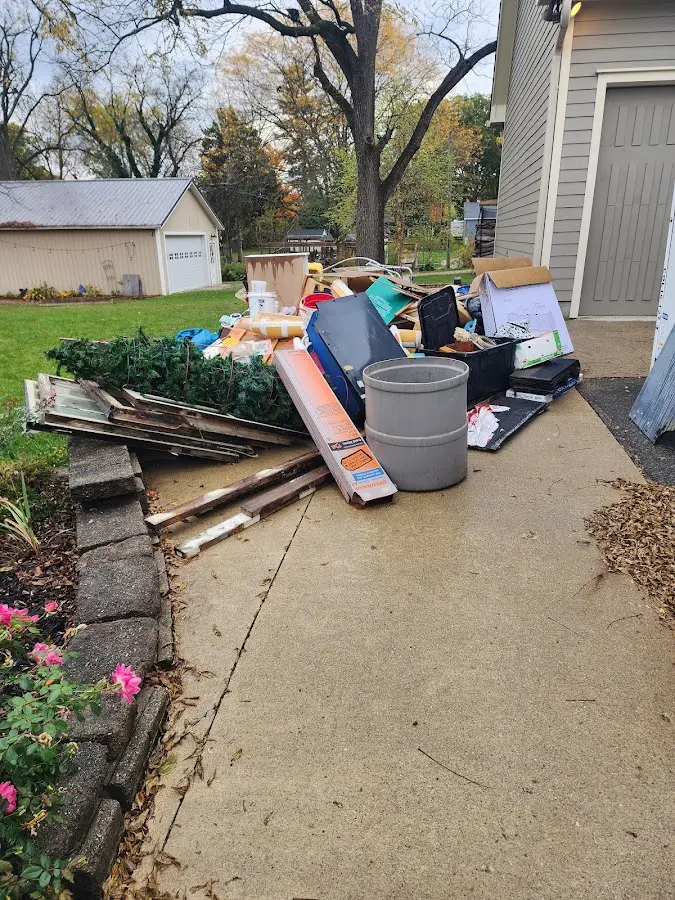 Dumpster being loaded with debris for Estate Cleanout Dumpster Rental in San Ramon